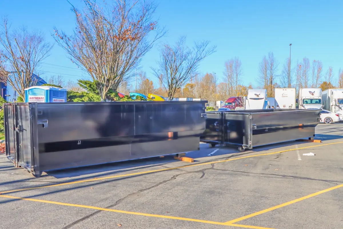 Professional dumpster rental service with roll-off container on residential driveway in South Brooksville